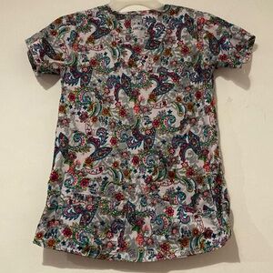 Pasliey Print Scrub Top with plenty of front pockets. Colorful and light…